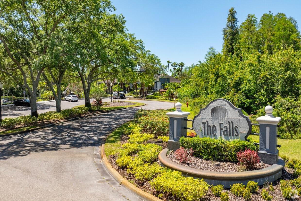 The Falls at New Tampa community entrance sign and landscaped drive